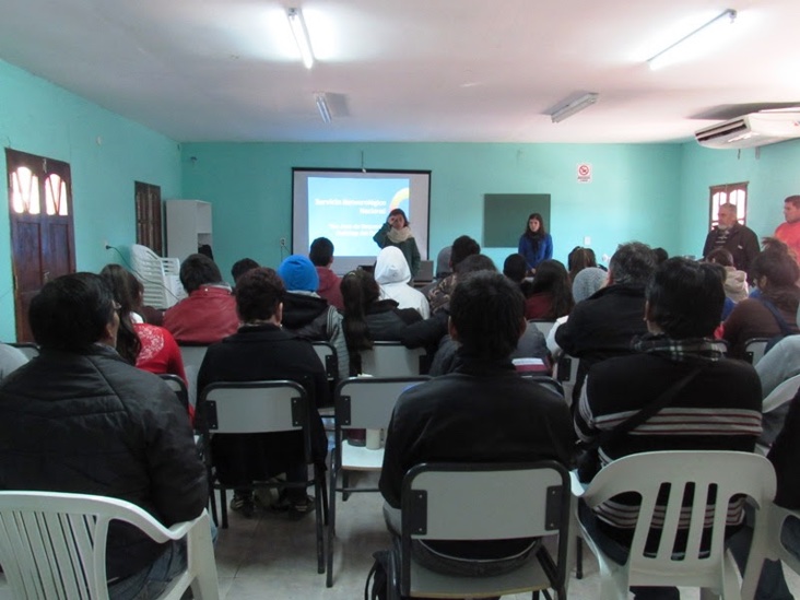 People watching slide presentation in small classroom